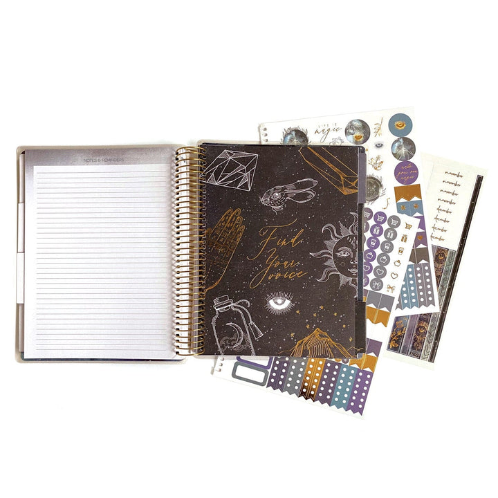 PL-2016E - Weekly Planner - Undated Celestial - Celestial-themed planner set with dark cover, stickers, tabs, and lined notebook pages in purple and gold tones