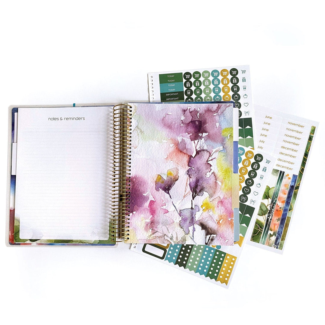 PL-2022E - Weekly Planner - Green Leaves - Spiral-bound planner with watercolor floral design, open to notes page, surrounded by decorative stickers and month tabs