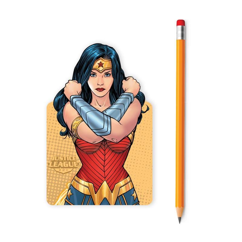 NBB-0060E - Mini Notebook - Wonder Woman - Yellow pencil displayed next to a rounded rectangular sticker featuring Wonder Woman in her iconic red, gold, and blue costume with crossed arms