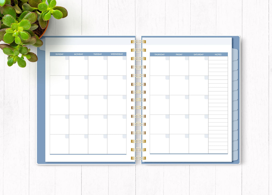 Wild and Free planner organizer image shown open to an inside monthly spread.