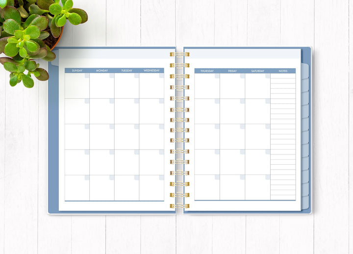 Wild and Free planner organizer image shown open to an inside monthly spread.