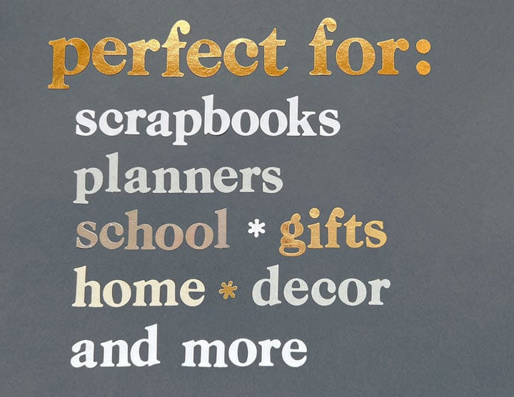 STBK-1000E - Alphabet Stickers - Alphabooks Classic Serifs - Gold and white alphabet sticker sheet on gray background listing uses: scrapbooks, planners, school gifts, home decor